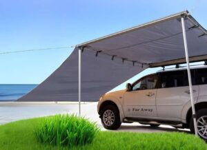 Szara markiza Far Away Equipment Classic z dodatkową ścianą boczną nad morzem