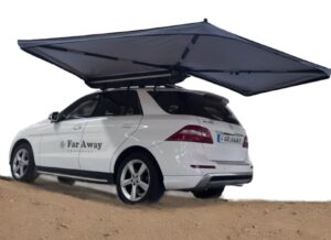 Samonośna markiza Foxwing Far Away Equipment rozłożona przy aucie w terenie