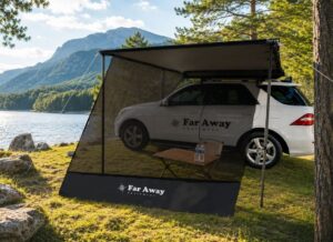 Sunblocker - zacieniacz Far Away Equipment zamontowany do markizy samochodowej nad jeziorem